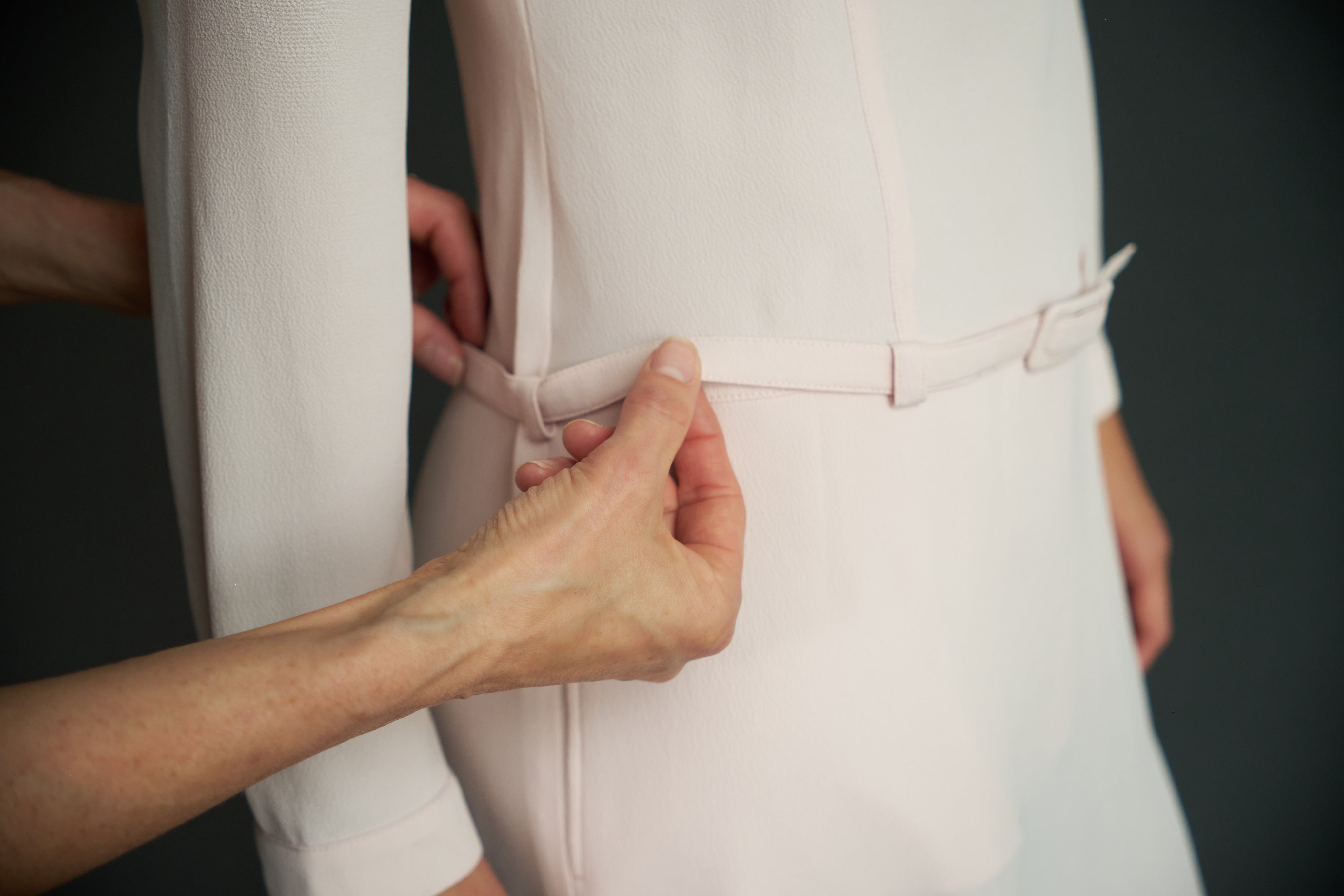 NOLESS garment being adjusted during a fitting